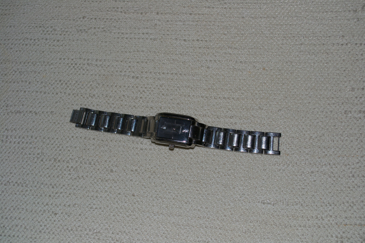 Fossil watch silver toned black background